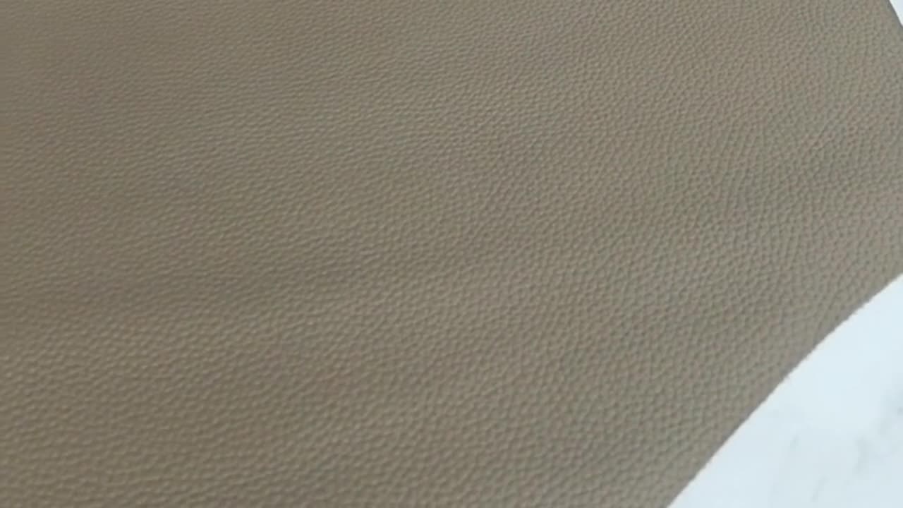 Pattern-locked cutting of pebbled genuine leather at LINJIN Manufacturing in Guangzhou